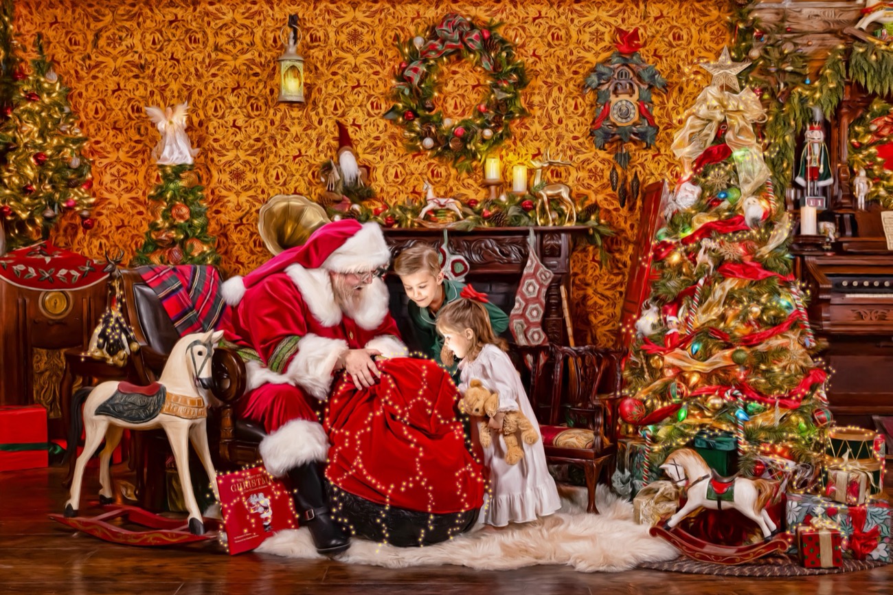 A child peeking inside Santa's bag