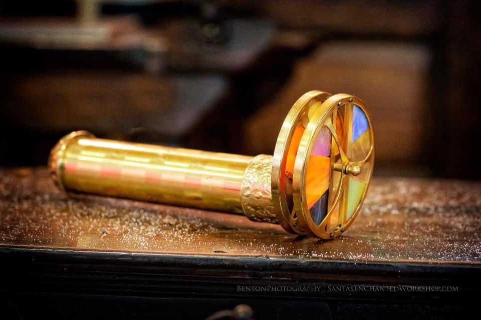 A brass kaleidoscope with panels of stained glass